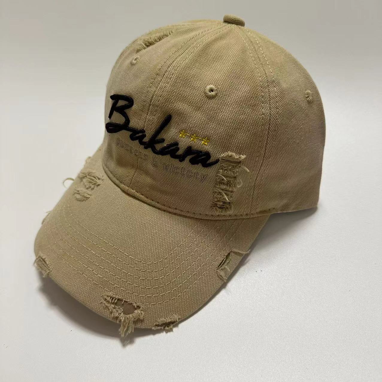 BAKARA Torn Caps